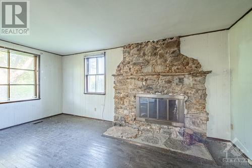 2720 Wylie Road, Glen Robertson, ON - Indoor With Fireplace