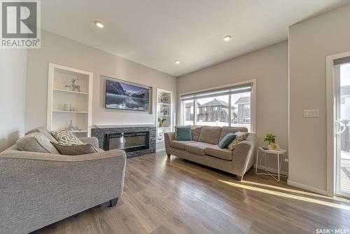 3323 Green Sandcherry Street, Regina, SK - Indoor Photo Showing Living Room With Fireplace