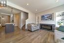 3323 Green Sandcherry Street, Regina, SK  - Indoor Photo Showing Living Room With Fireplace 