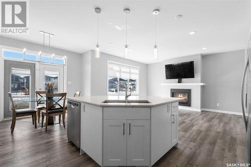 563 Bolstad Turn, Saskatoon, SK - Indoor Photo Showing Kitchen With Fireplace With Upgraded Kitchen