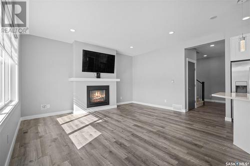 563 Bolstad Turn, Saskatoon, SK - Indoor Photo Showing Living Room With Fireplace