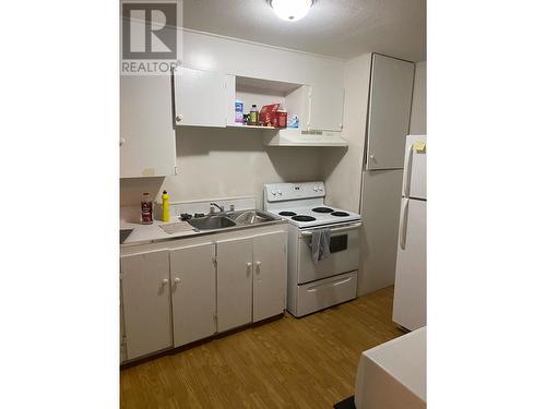 4912 Sunset Drive, Fort Nelson - Town, BC - Indoor Photo Showing Kitchen With Double Sink