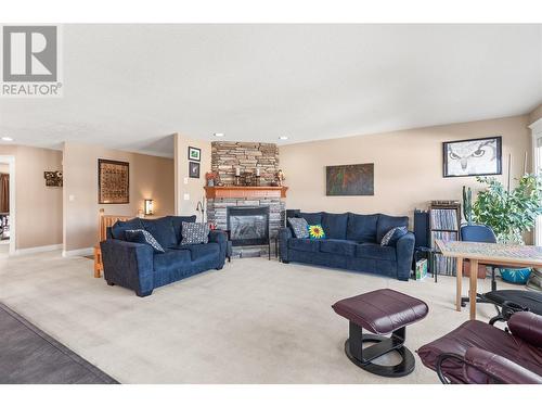 7344 Longacre Drive, Vernon, BC - Indoor Photo Showing Living Room With Fireplace