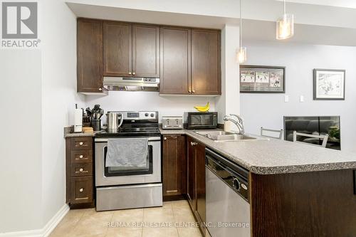 #604 -1011 Deta Rd, Mississauga, ON - Indoor Photo Showing Kitchen With Stainless Steel Kitchen With Double Sink