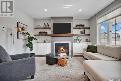 144 Thakur Street, Saskatoon, SK - Indoor Photo Showing Living Room With Fireplace