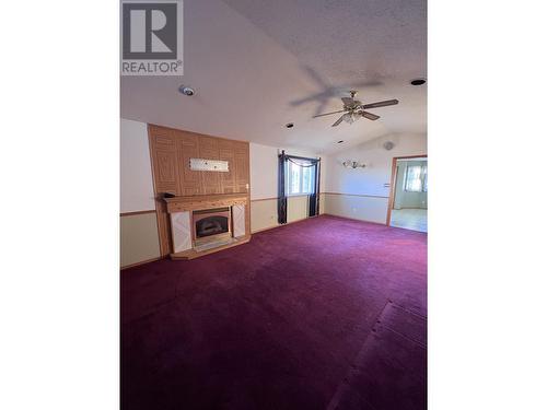 3928 Cottonwood Road, Fort Nelson, BC - Indoor Photo Showing Other Room With Fireplace