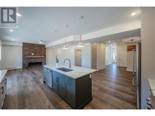 1719 Britton Road, Summerland, BC - Indoor Photo Showing Kitchen With Fireplace With Double Sink