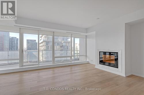 #3203 -180 University Ave, Toronto, ON - Indoor Photo Showing Living Room With Fireplace