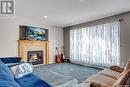 4859 Singer Court, Regina, SK  - Indoor Photo Showing Living Room With Fireplace 