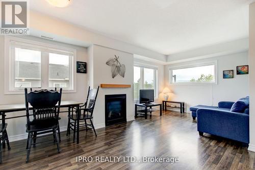 #308 -6 Anchorage Cres, Collingwood, ON - Indoor Photo Showing Living Room With Fireplace