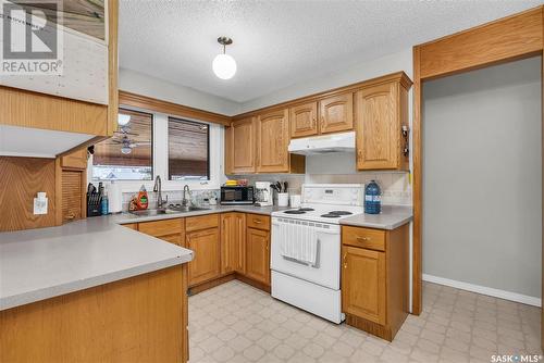 21 Birch Drive, Birch Hills, SK - Indoor Photo Showing Kitchen With Double Sink