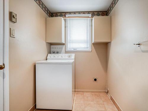 Powder room - 670 Rue Ravel, Brossard, QC - Indoor Photo Showing Laundry Room