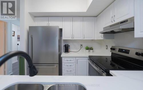 2054 - 3041 Finch Avenue W, Toronto, ON - Indoor Photo Showing Kitchen With Stainless Steel Kitchen With Double Sink