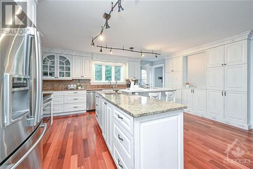 Kitchen with large island with eating area - 12374 County Road 43 Road, Winchester, ON 