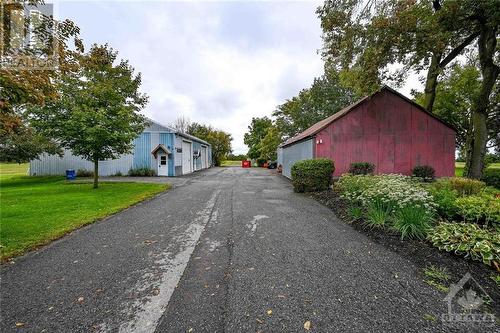 Paved drive-way that leads to a large gravel yard, 2 of 3 sheds for your hobbies or business! - 12374 County Road 43 Road, Winchester, ON 