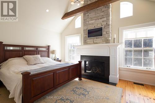 1234 Old River Rd, Mississauga, ON - Indoor Photo Showing Bedroom With Fireplace