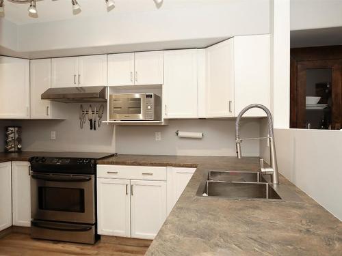 406-3115 De Montreuil Court, Kelowna, BC - Indoor Photo Showing Kitchen With Double Sink