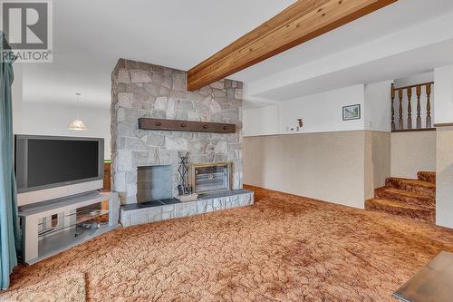 1590 Willow Crescent, Kelowna, BC - Indoor Photo Showing Other Room With Fireplace