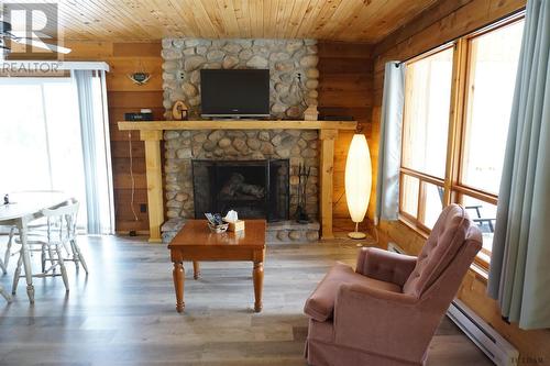 59 Ontario St, Elk Lake, ON - Indoor Photo Showing Living Room With Fireplace