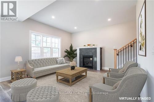 19 Cambridge Rd E, Fort Erie, ON - Indoor Photo Showing Living Room With Fireplace