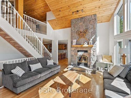 1397 Port Cunnington Rd, Lake Of Bays, ON - Indoor Photo Showing Living Room With Fireplace