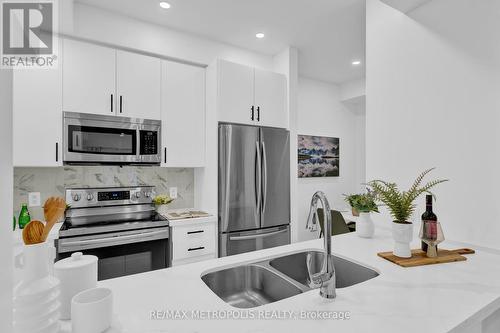 Th55 - 295 Village Green Square, Toronto, ON - Indoor Photo Showing Kitchen With Stainless Steel Kitchen With Double Sink
