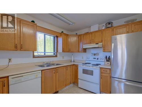 1584 Highway 33 E, Kelowna, BC - Indoor Photo Showing Kitchen With Double Sink