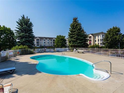 104-3163 Richter Street, Kelowna, BC - Outdoor With In Ground Pool