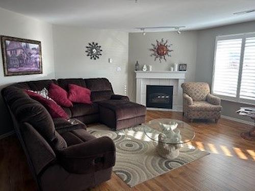 408-6805 Cottonwood Drive, Osoyoos, BC - Indoor Photo Showing Living Room With Fireplace