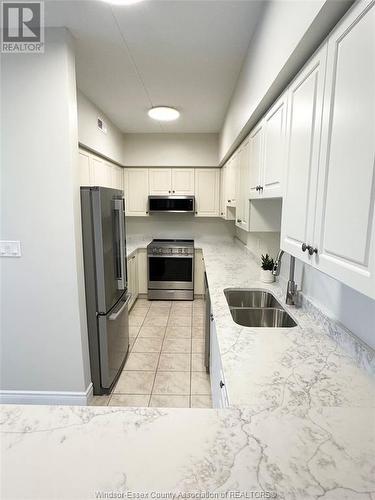 200 Manning Unit# 409, Tecumseh, ON - Indoor Photo Showing Kitchen With Double Sink