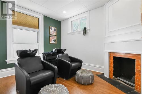 Beautiful original fireplace for aesthetics - 7 Argyle Street, Renfrew, ON - Indoor Photo Showing Other Room With Fireplace