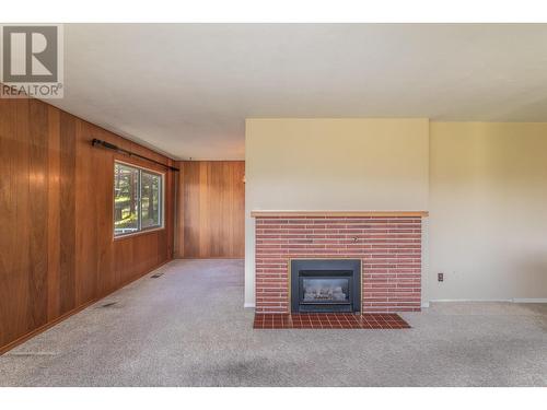 4729 Lakeshore Road, Kelowna, BC - Indoor Photo Showing Other Room With Fireplace