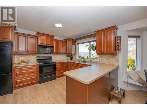 25 Lambert Place, Coldstream, BC - Indoor Photo Showing Kitchen With Double Sink
