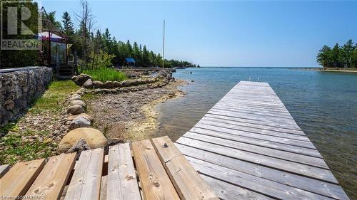 Solid dock leading to your next adventure! - 7 Purgatory Road, Northern Bruce Peninsula, ON - Outdoor With Body Of Water With View