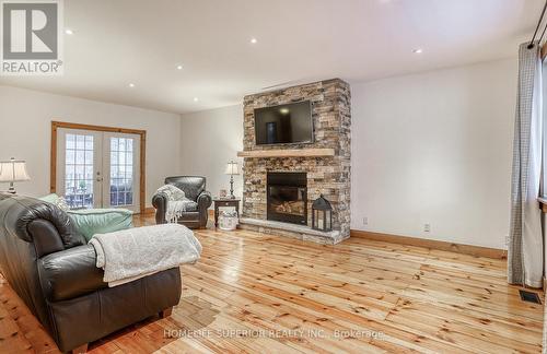 3795 Liberty St N, Clarington, ON - Indoor Photo Showing Living Room With Fireplace