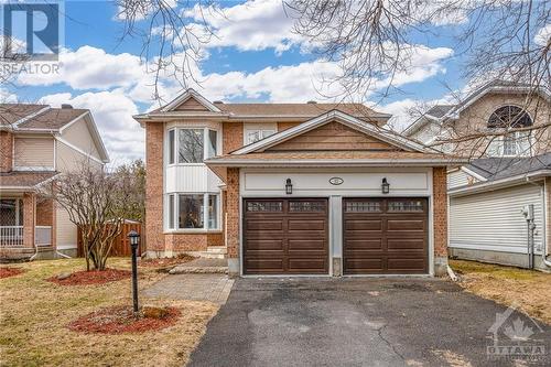 Mature maples provide a beautiful canopy down the quiet crescent. - 22 Fernbrook Place, Kanata, ON - Outdoor With Facade
