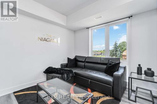 312 - 6065 Mcleod Road N, Niagara Falls, ON - Indoor Photo Showing Living Room