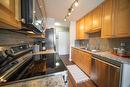 201 - 51 Ridgemont Drive, Fernie, BC  - Indoor Photo Showing Kitchen With Double Sink 