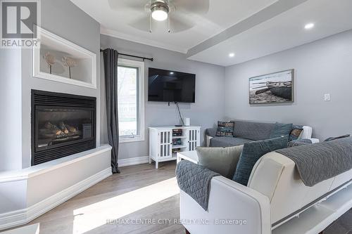 215 Vimy Rdge W, Central Elgin, ON - Indoor Photo Showing Living Room With Fireplace