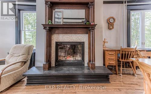 30 Head St, Mapleton, ON - Indoor Photo Showing Living Room With Fireplace