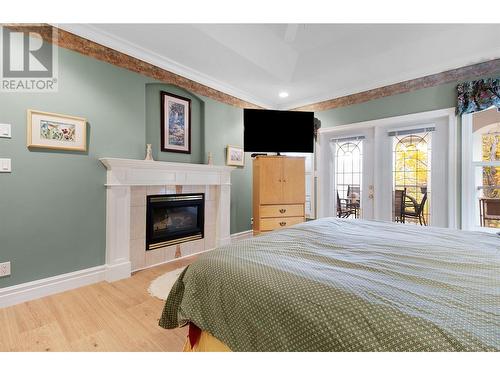 3638 Parri Road, Tappen, BC - Indoor Photo Showing Bedroom With Fireplace