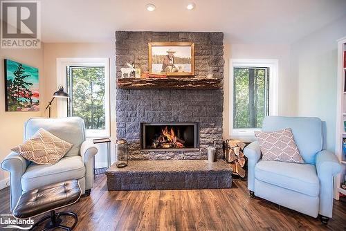 340 Healey Lake, Archipelago South, ON - Indoor Photo Showing Living Room With Fireplace