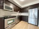 #927 -376 Highway 7  E, Richmond Hill, ON  - Indoor Photo Showing Kitchen With Upgraded Kitchen 