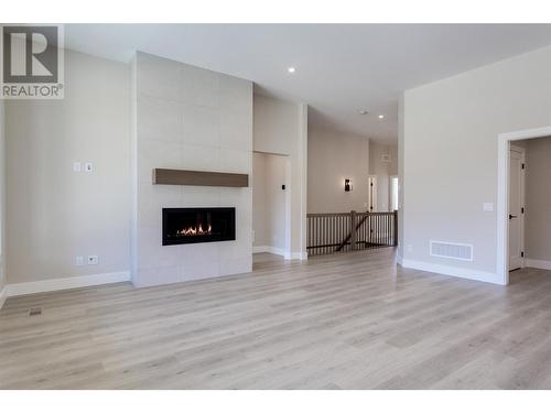 3438 Hilltown Close, Kelowna, BC - Indoor Photo Showing Living Room With Fireplace