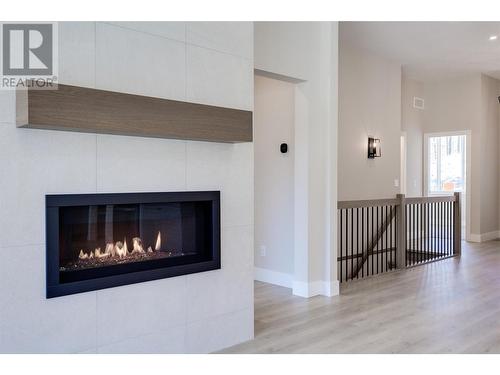 3438 Hilltown Close, Kelowna, BC - Indoor Photo Showing Living Room With Fireplace