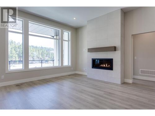 3438 Hilltown Close, Kelowna, BC - Indoor Photo Showing Living Room With Fireplace
