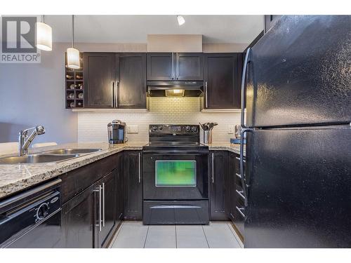 1089 Sunset Drive Unit# 410, Kelowna, BC - Indoor Photo Showing Kitchen With Double Sink