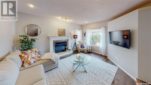 4219 Wascana Ridge, Regina, SK - Indoor Photo Showing Living Room With Fireplace
