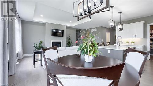 33 Brooklawn Dr, Lambton Shores, ON - Indoor Photo Showing Dining Room With Fireplace