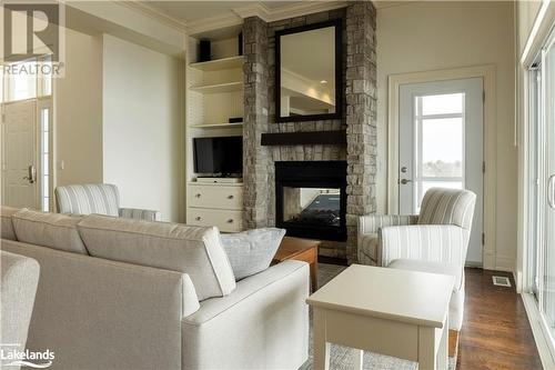 1869 Muskoka Road 118 W Unit# T202-D1, Muskoka Lakes, ON - Indoor Photo Showing Living Room With Fireplace